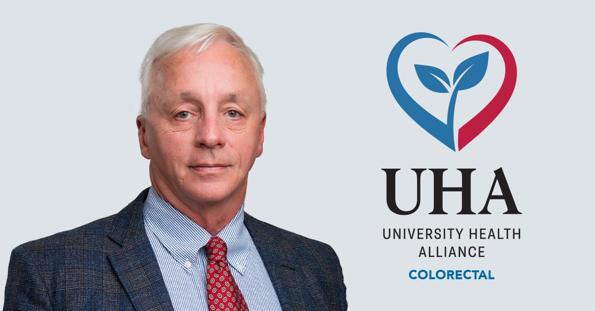 Dr. Delaurier with UHA logo